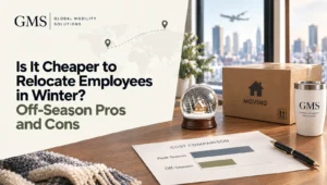 Snow globe, moving box and a peak season versus off-season cost comparison sheet on a desk