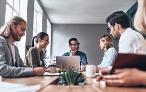 Team of colleagues meeting around a conference table