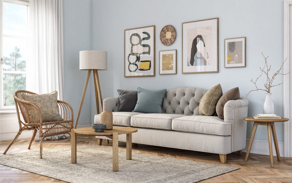Furnished living room with a sofa and framed wall art