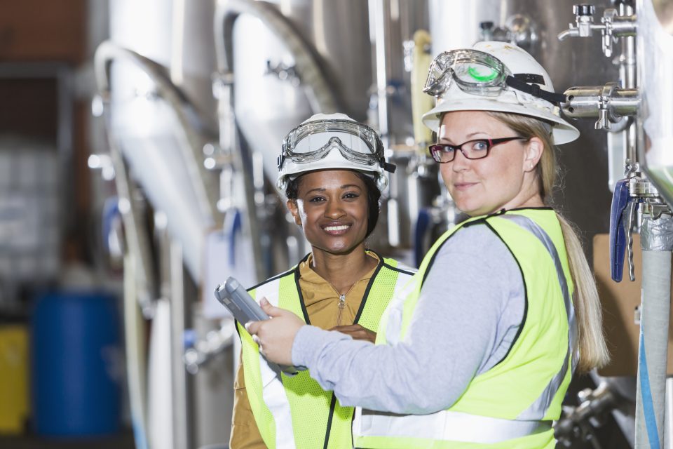 Manufacturing employees working in their workspace