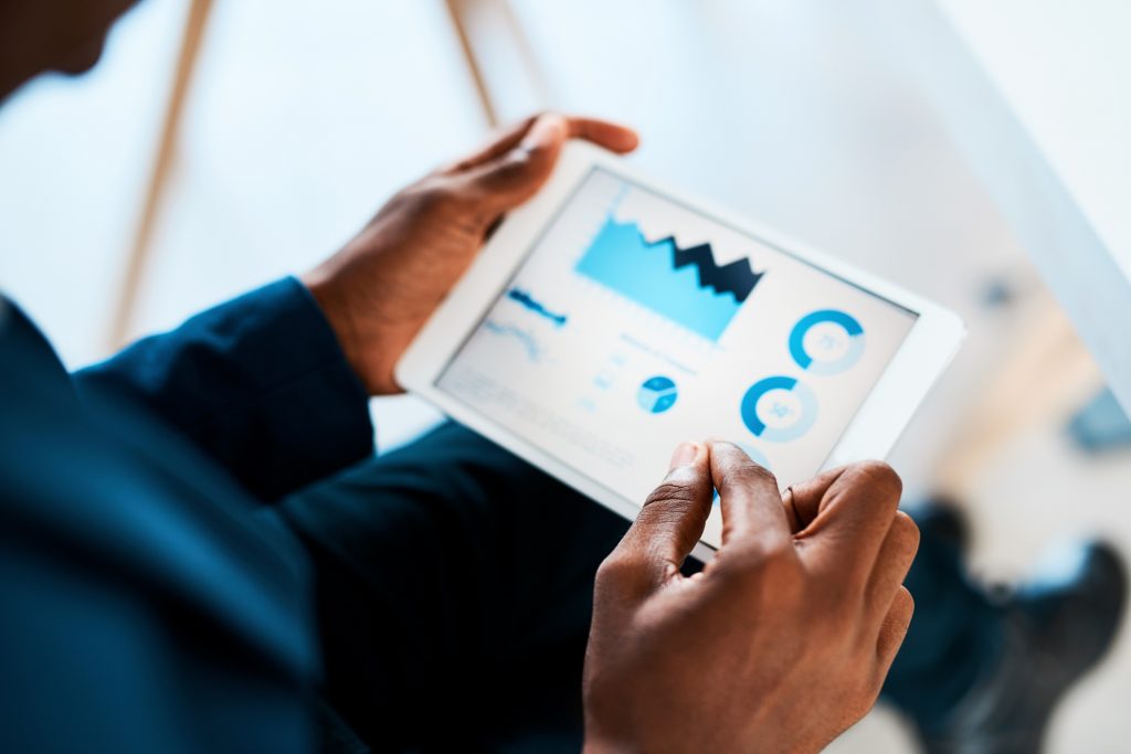 Person reviewing charts on a tablet