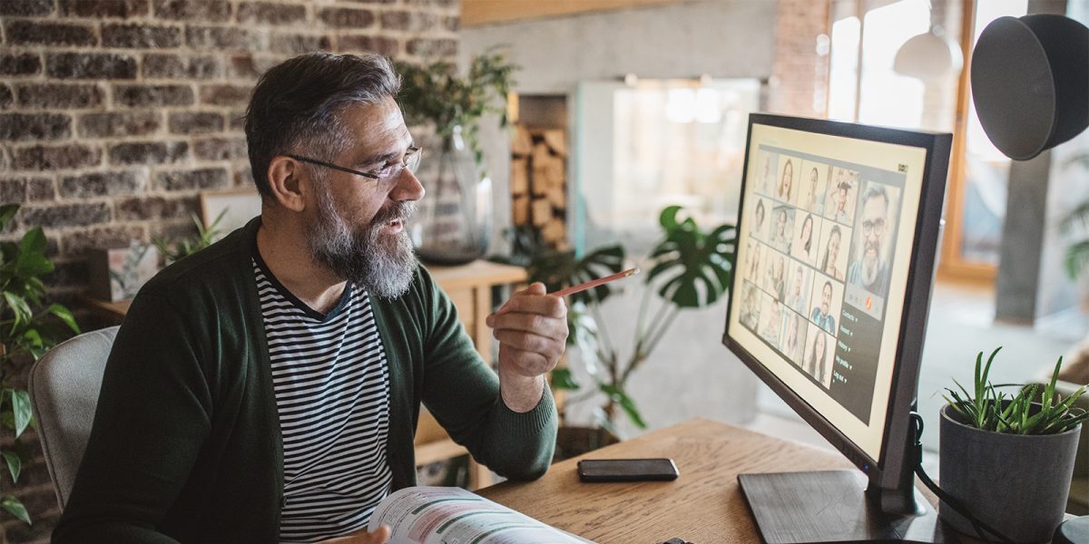 Smiling man working on computer