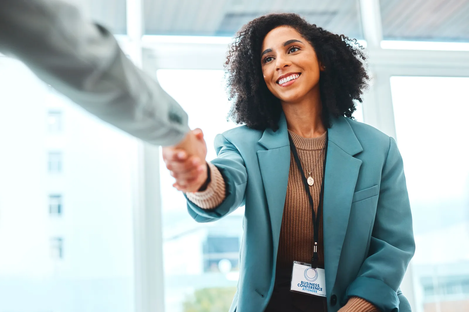 pretty African American female shaking hands with her new boss
