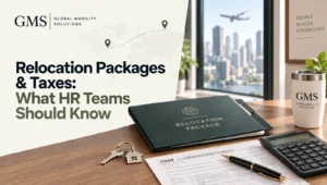 Relocation package folder with tax form, calculator and house keychain on a desk